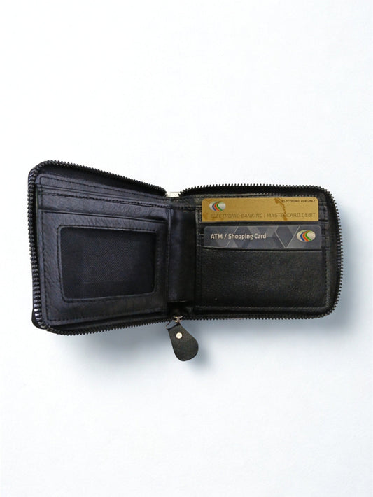 Open interior view of black leather zip-around wallet displaying card slots and ID window