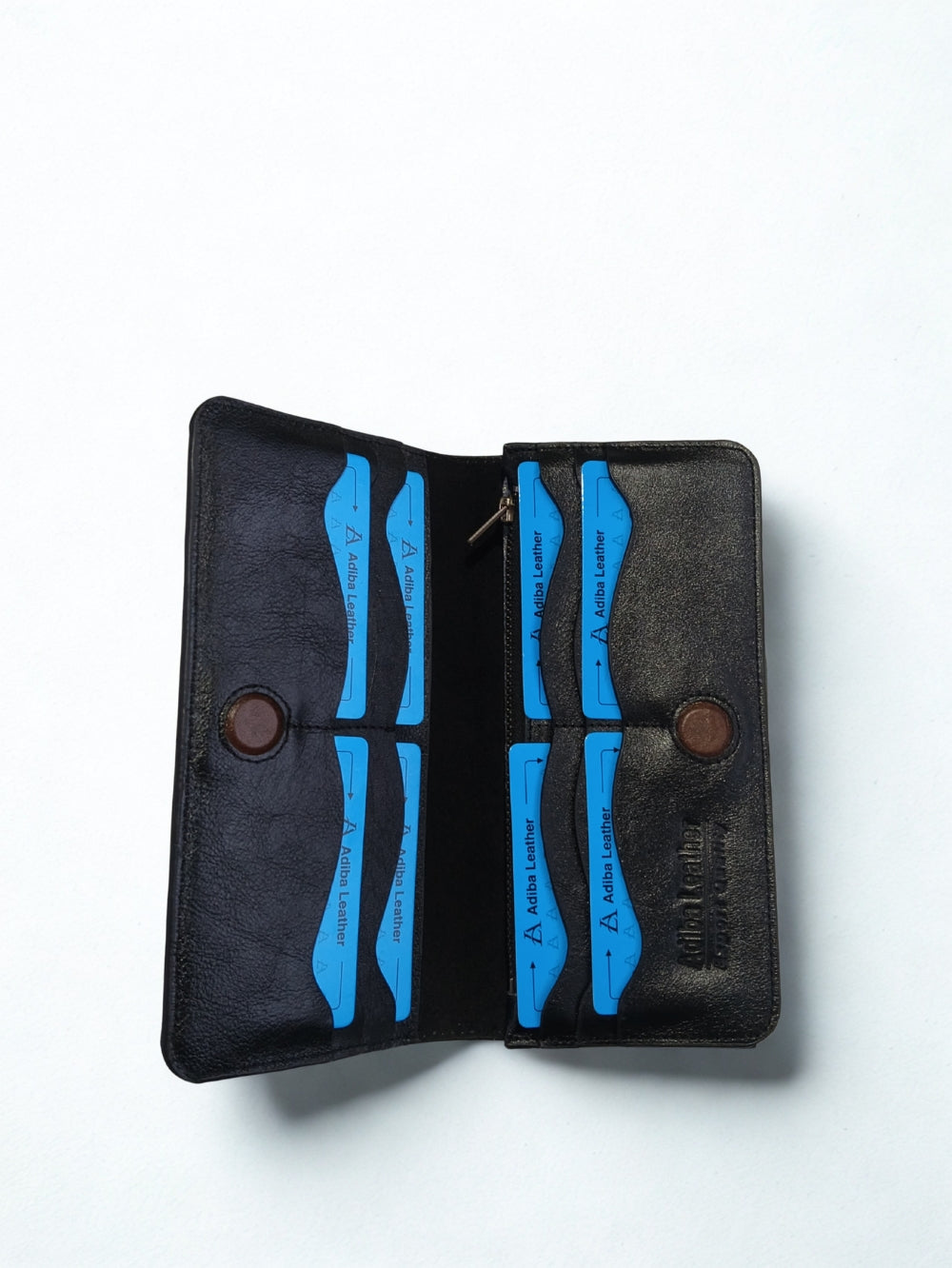 Open interior of Adiba Leather black long wallet displaying card slots, zipper pocket, and magnetic closures