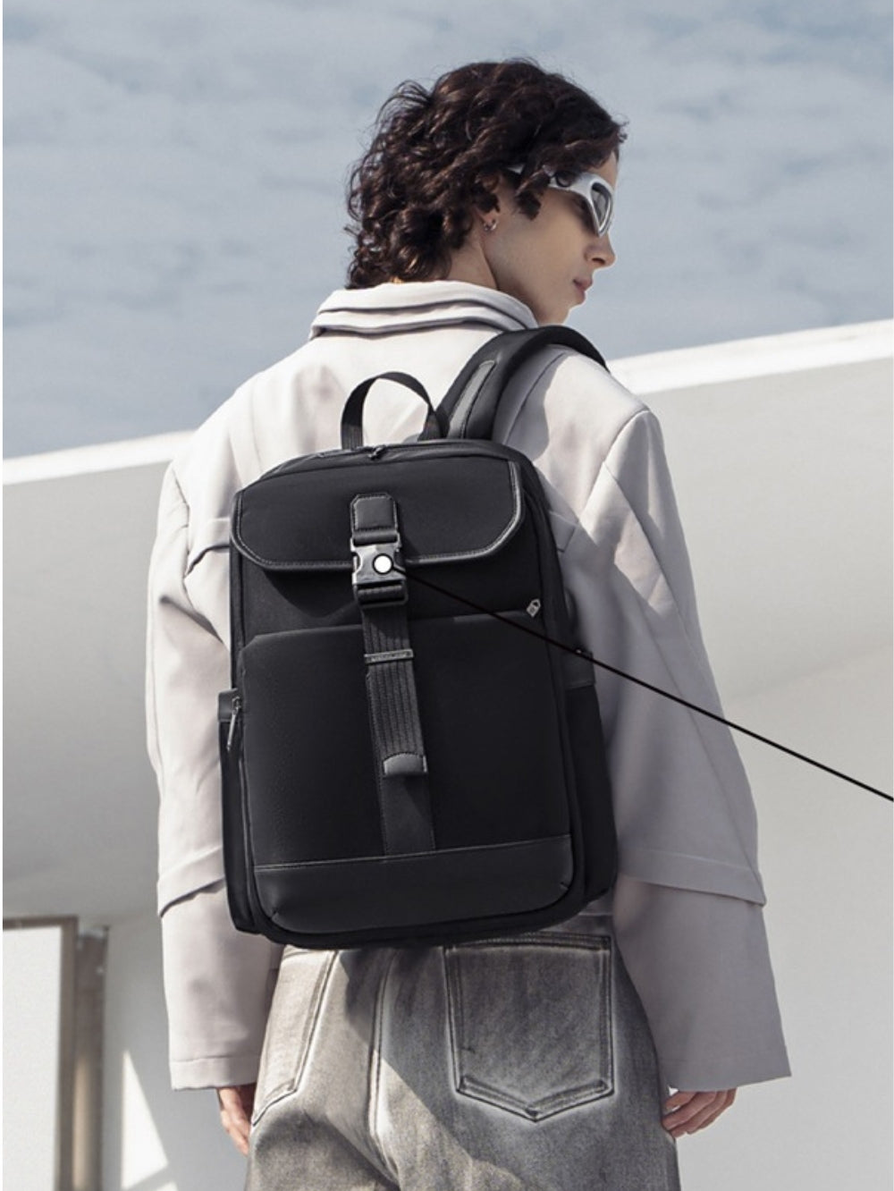 Model carrying Arctic Hunter B00812 black waterproof premium laptop backpack lifestyle view