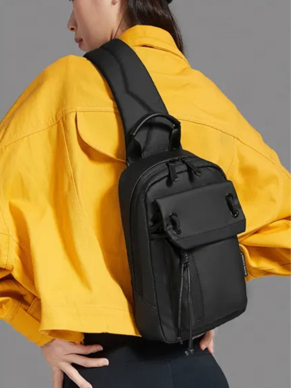 Arctic Hunter XB00526 black crossbody sling bag worn on back by model lifestyle view