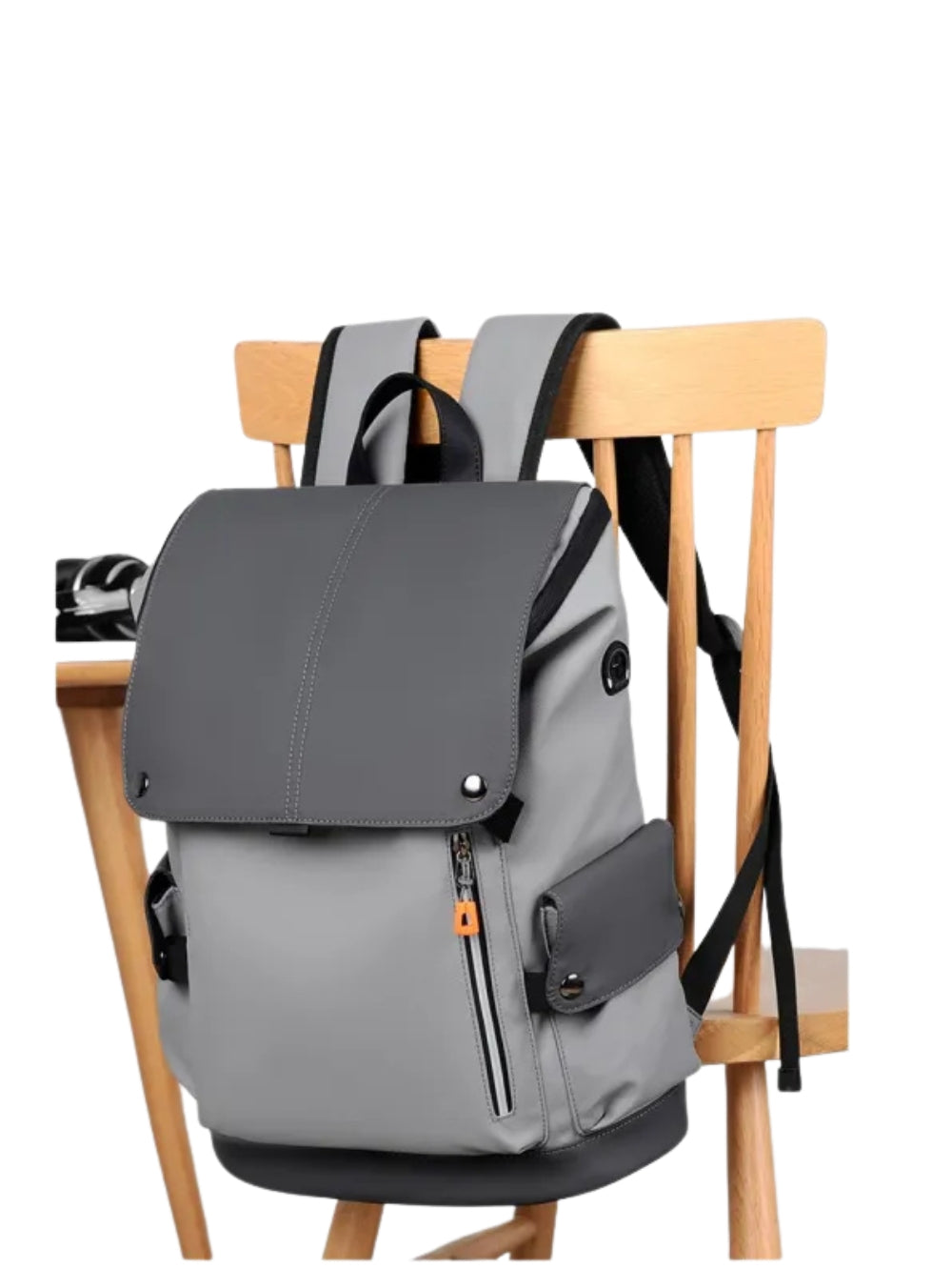 Grey  Japanese style tooling backpack placed on a wooden chair