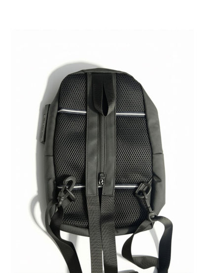 Back view of CR7 black sling bag showing zip-convertible backpack strap, side combination lock, and mesh padding