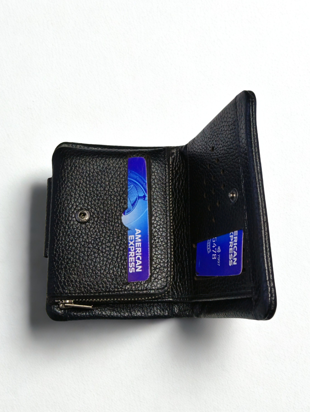 Open interior of black Esiposs leather wallet showing credit card slots and zipper compartment