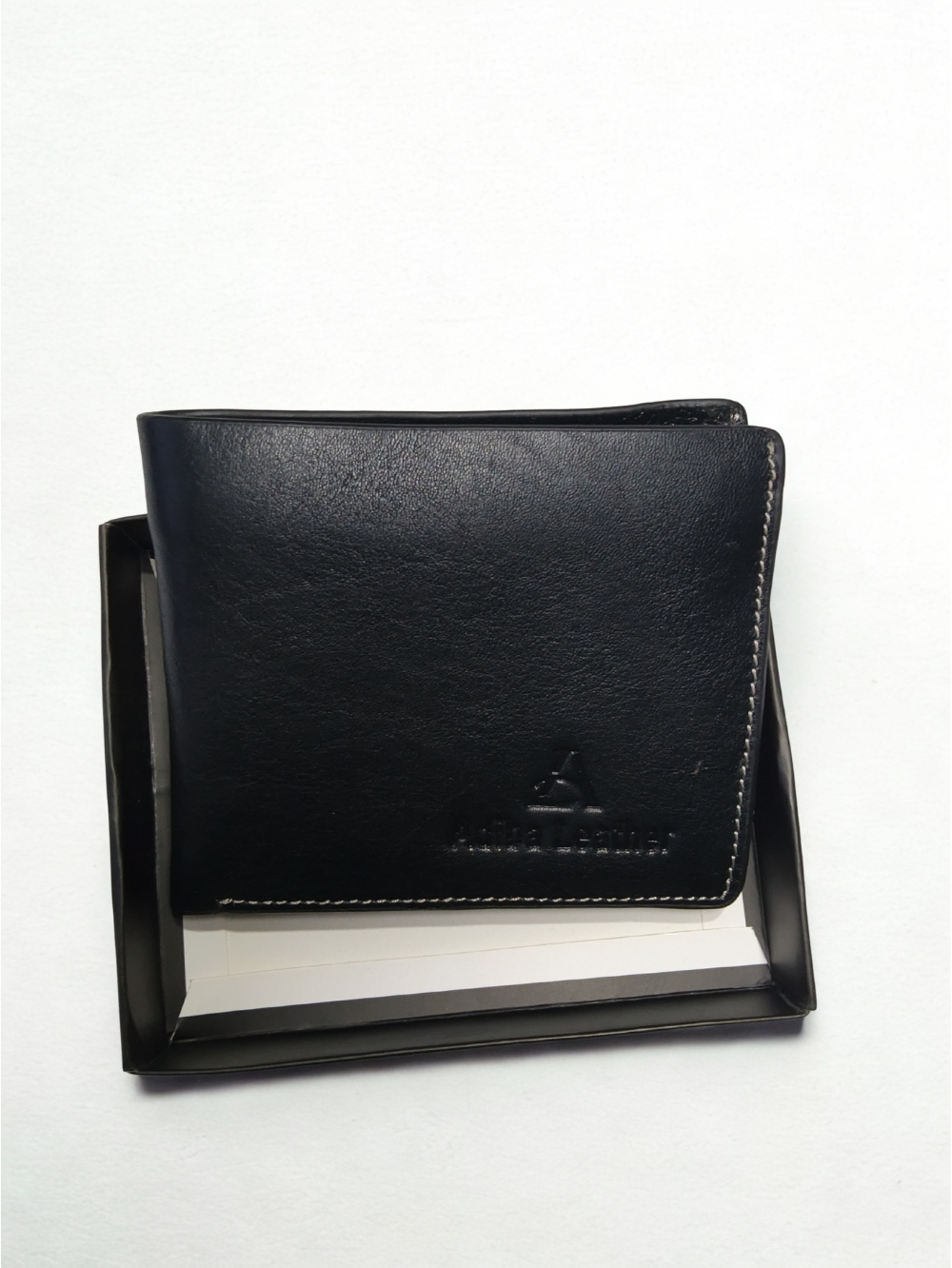 Black leather men's bi-fold wallet packaged inside a sleek black presentation box