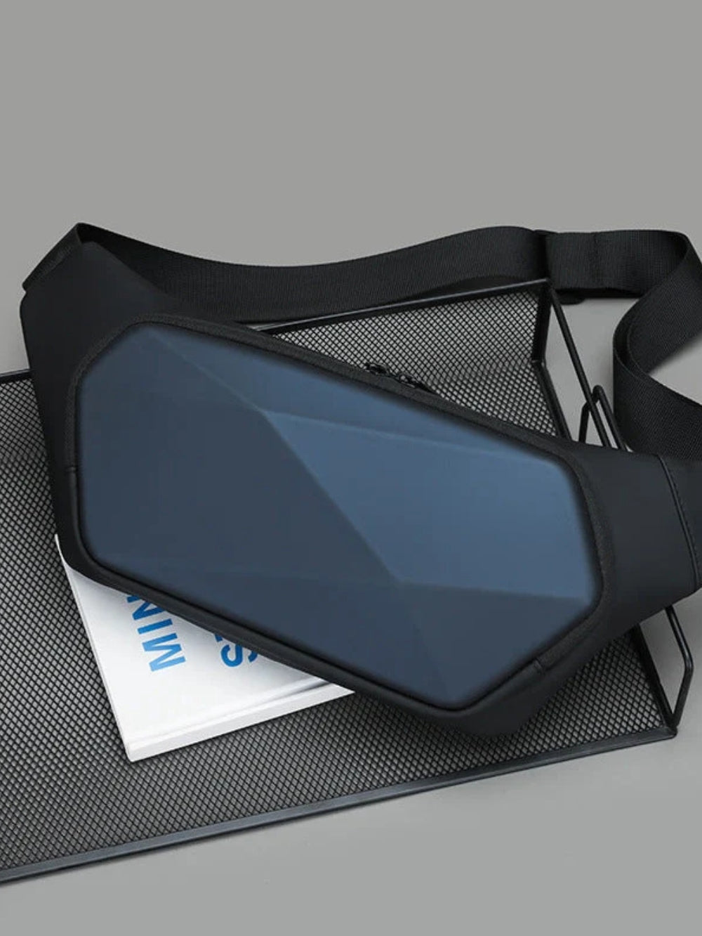 blue hard shell rhombus chest pack for men on display tray