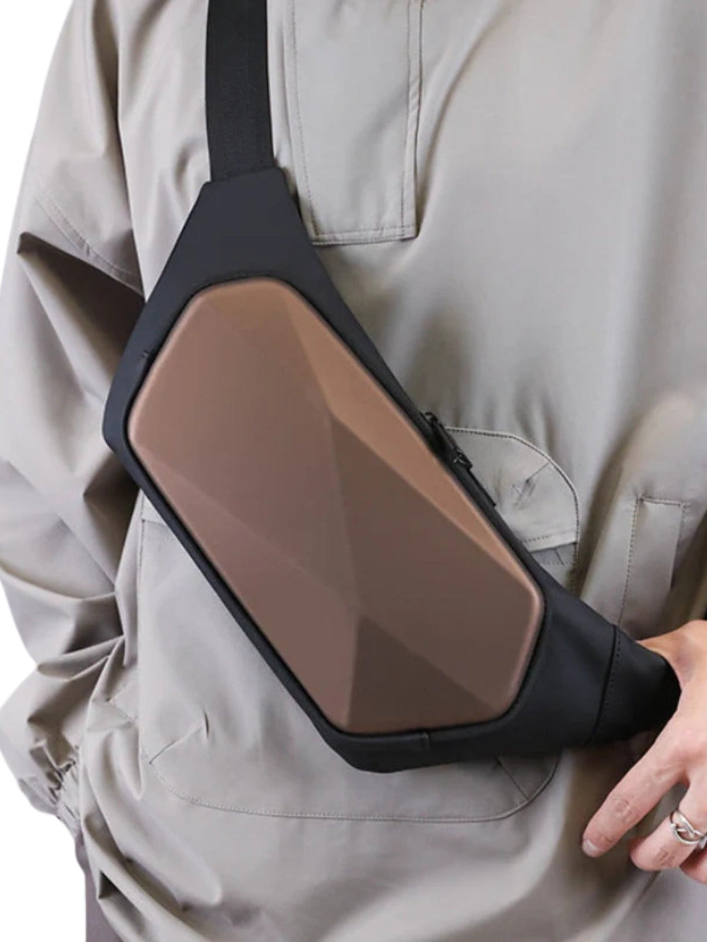 brown hard shell geometric rhombus chest sling bag worn by model