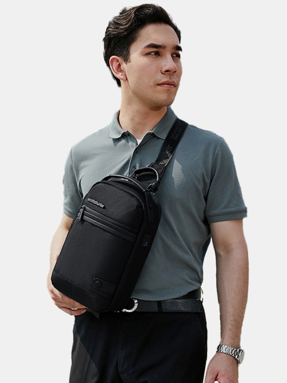 LAVIZAR anti-theft crossbody sling bag in black worn by male model lifestyle view