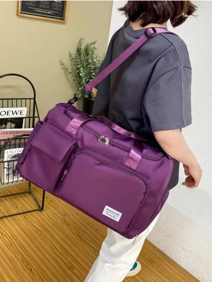 LAVIZAR purple travel and gym duffle bag carried over shoulder lifestyle view