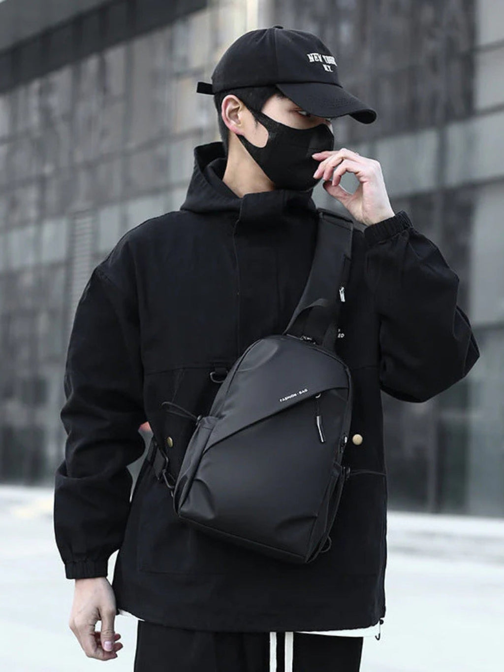 LAVIZAR deep Black crossbody sling chest pack worn by male model