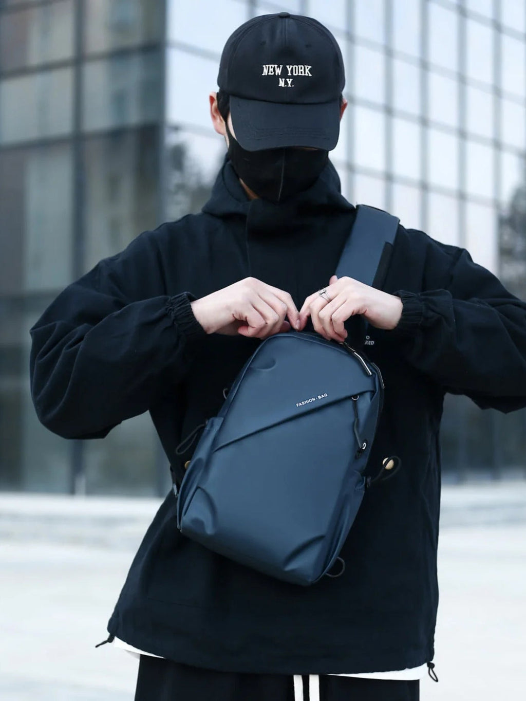 LAVIZAR deep navy crossbody sling chest pack worn by male model