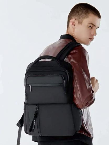 black waterproof anti theft laptop backpack worn by travel man 