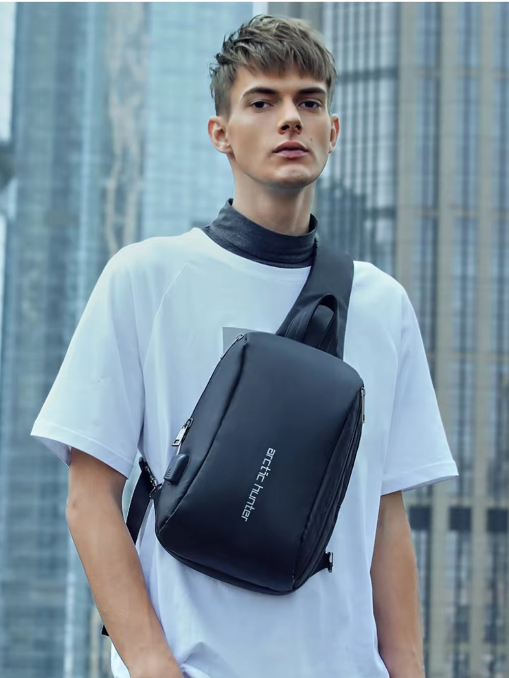 LAVIZAR waterproof outdoor sling bag worn across chest by male model lifestyle view