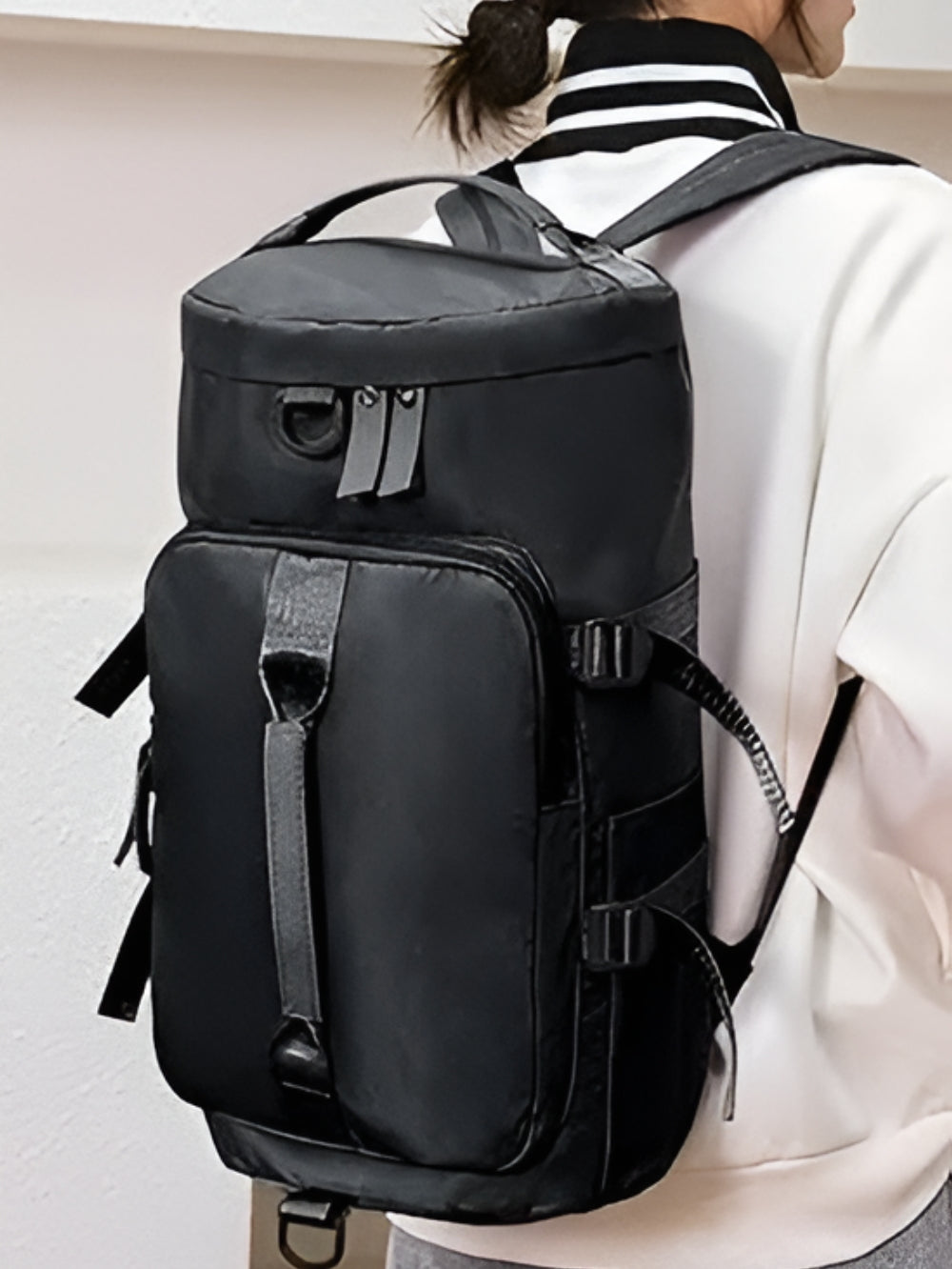 LAVIZAR convertible travel duffle backpack worn by model as a backpack