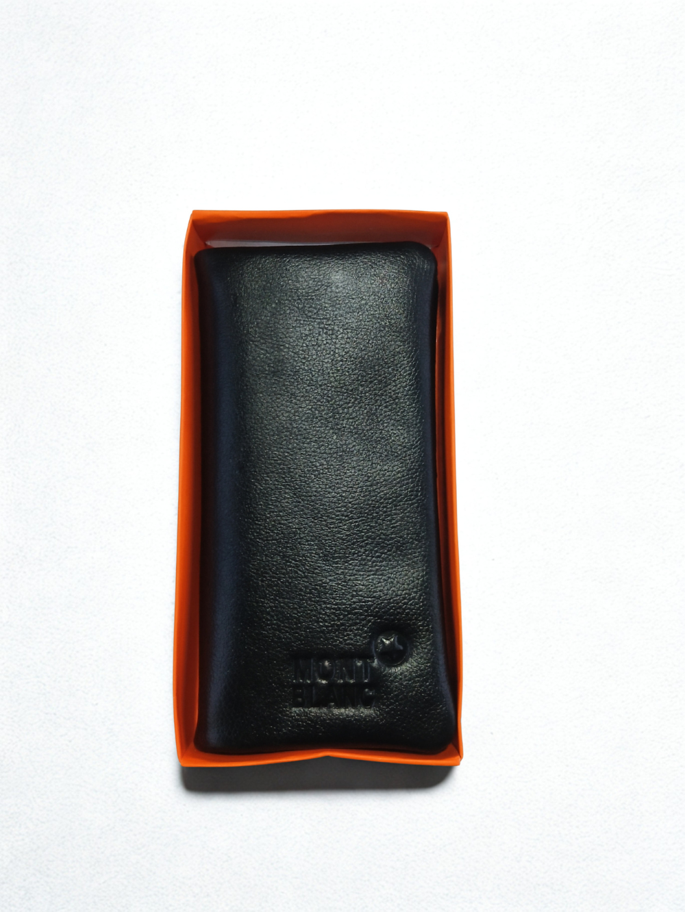 Black leather men long wallet displayed inside orange presentation box