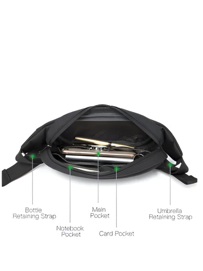 black crossbody chest bag open showing interior pockets and retaining straps