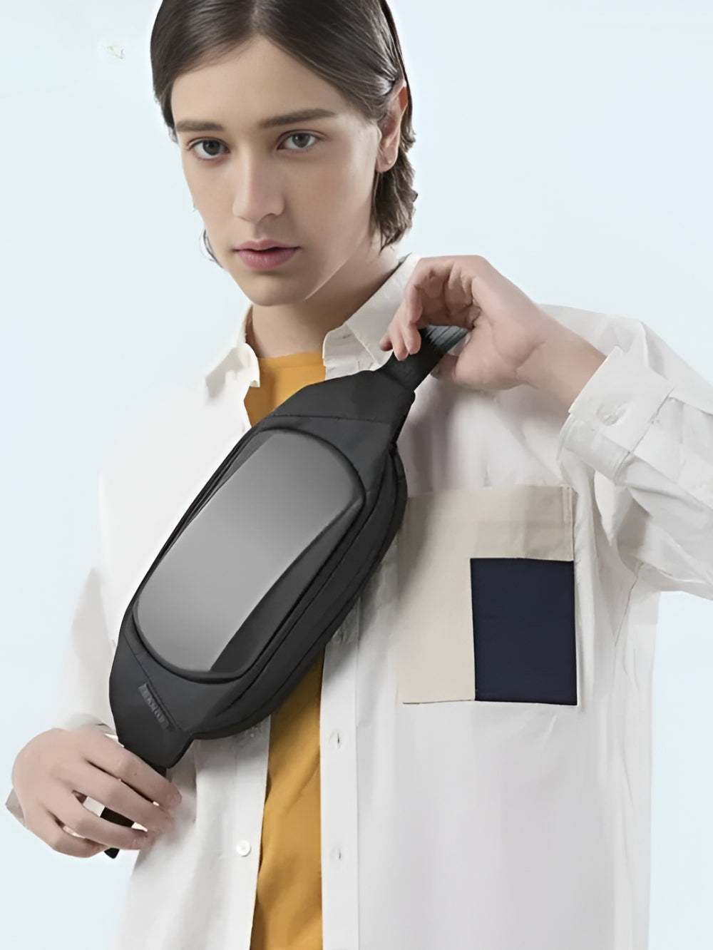 black waterproof anti-theft crossbody chest bag worn by male model